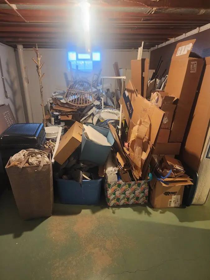 Roll-off dumpster container at job site for 15 Yard Dumpster Rental in Kinross